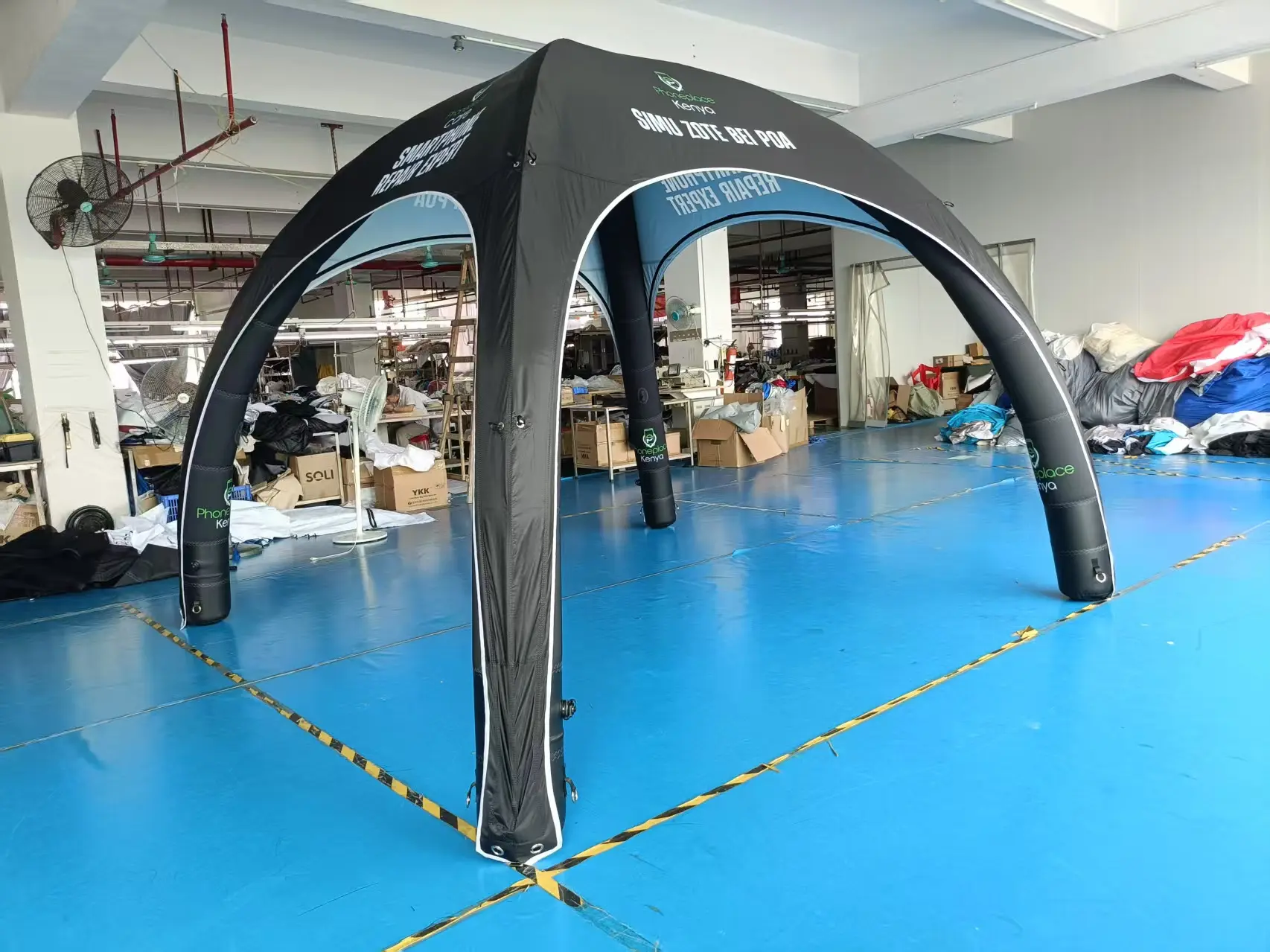 Custom branded inflatable tent for Phoneplace Kenya with black and blue design..jpg